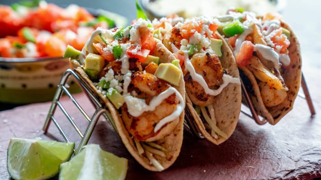 Shrimp tacos with limes and pico de gallo