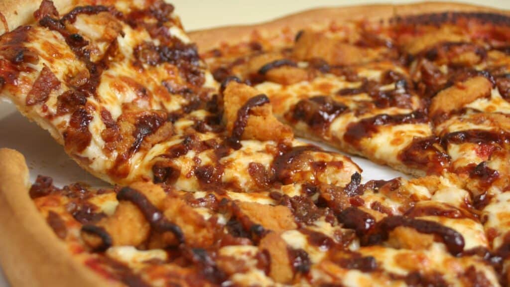 Close-up of barbecue chicken pizza slice