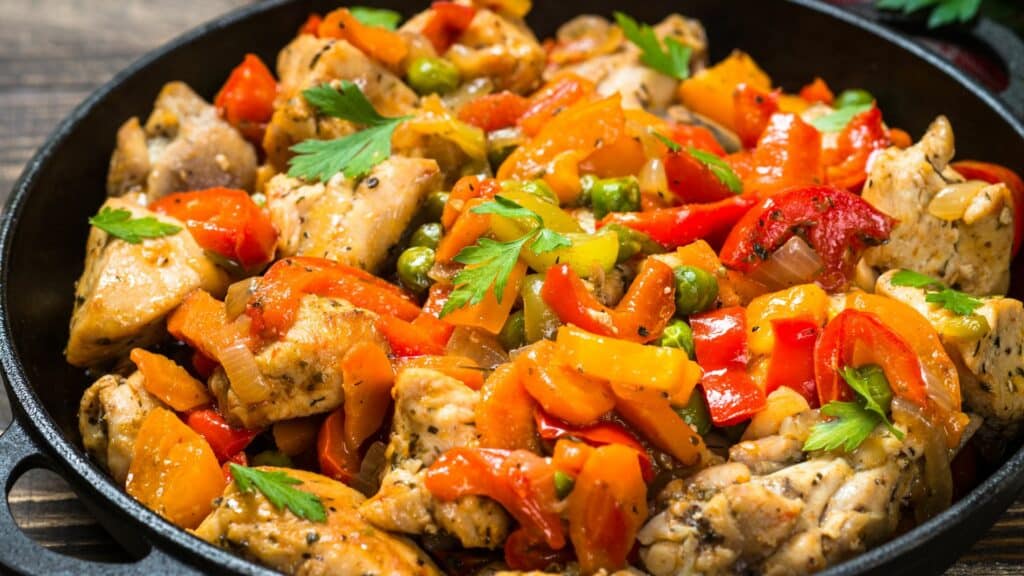 Chicken stir-fry with vegetables in a skillet