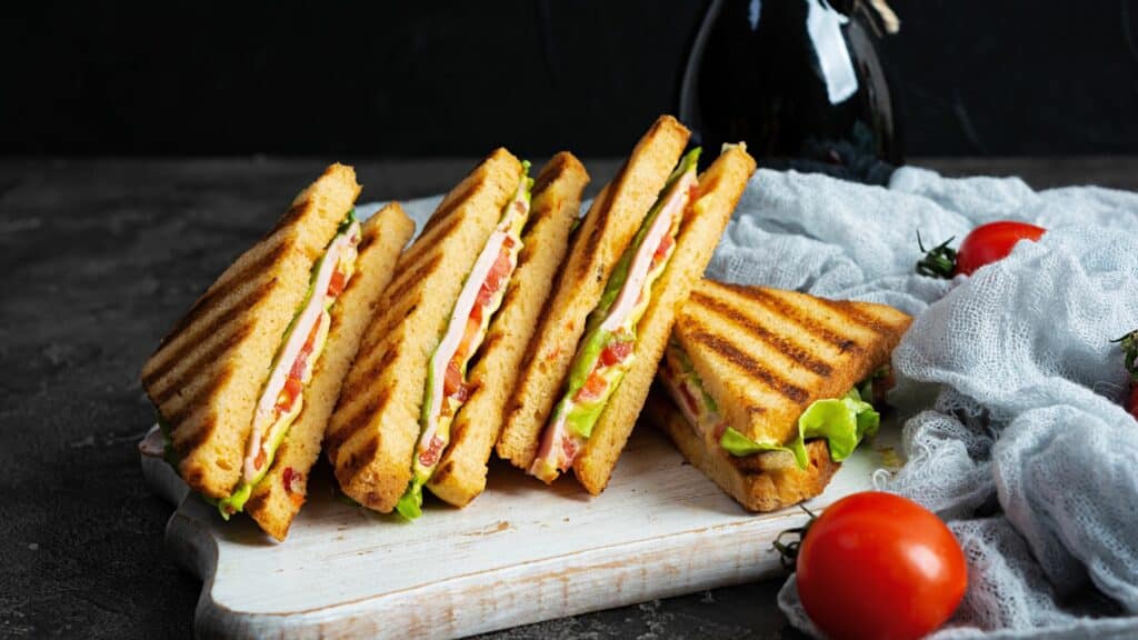 Grilled turkey sandwiches with tomatoes and lettuce