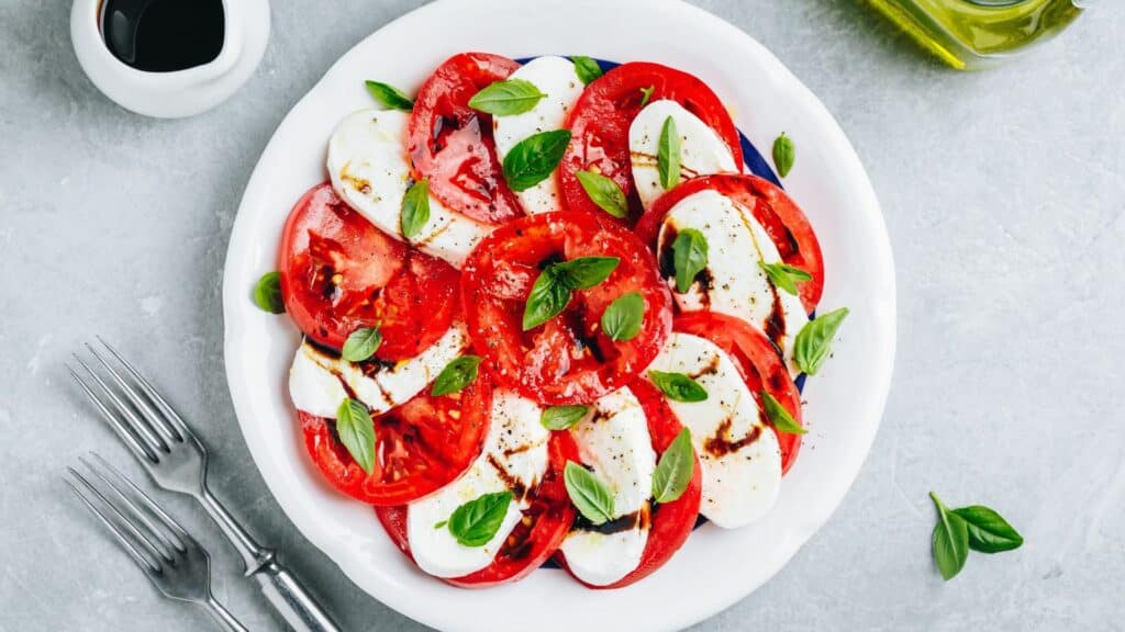 Caprese salad with tomatoes, mozzarella, and basil