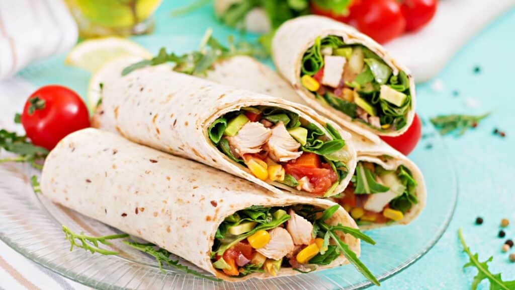 Chicken and vegetable wraps on plate