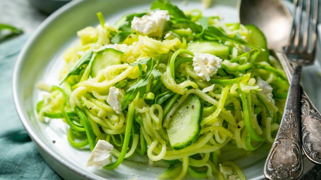 Zucchini noodles with feta cheese and greens.