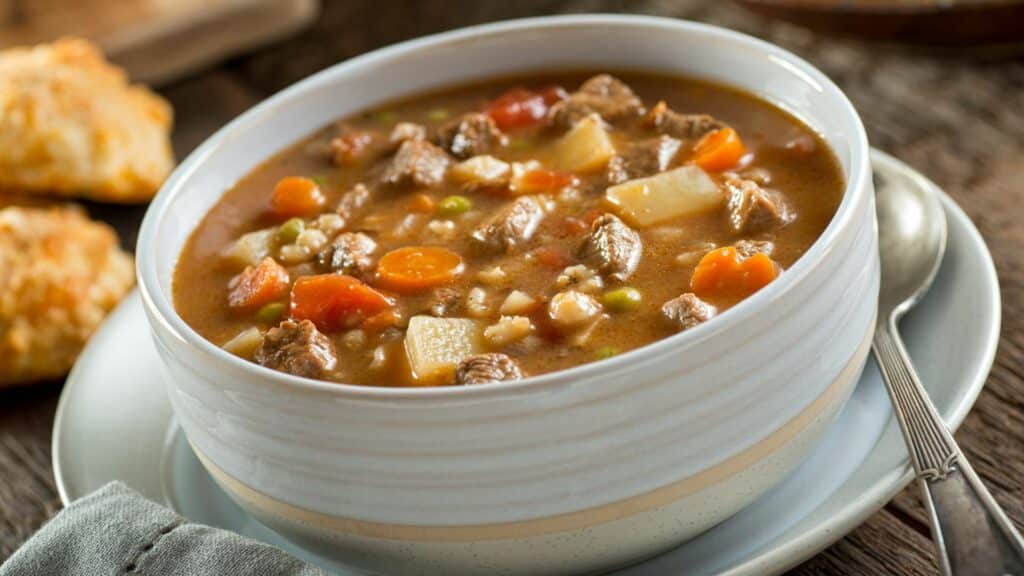 Bowl of hearty beef stew with vegetables.