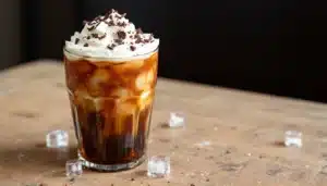 Iced coffee with whipped cream and chocolate sprinkles